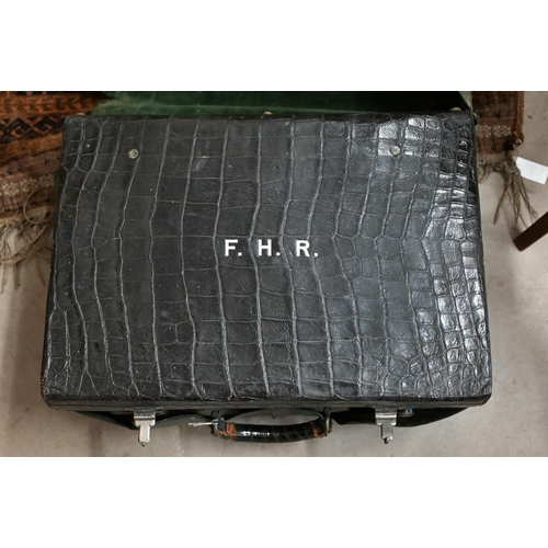 579 - A vintage crocodile-skin suitcase with green satin lining (lacks fittings), by Drew & Sons of Pi... 