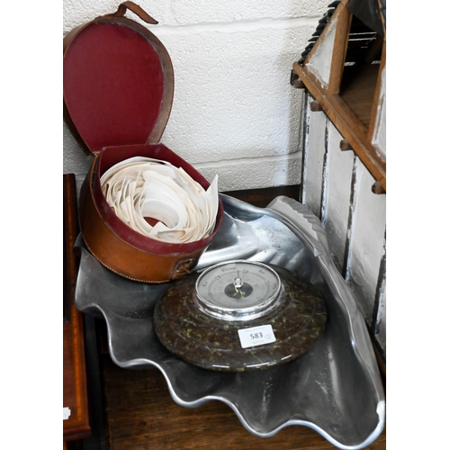 583 - An aluminium clam-shell bowl, 53 cm wide, to/w an aneroid barometer in turned serpentine case and a ... 