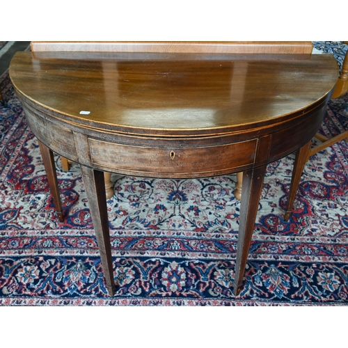 591 - A Victorian boxwood inlaid mahogany demi-lune tea table raised on double gate legs to spade toes, 10... 