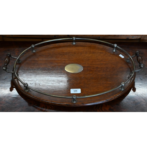 594 - An antique silver plate mounted oval oak twin handled tray, 55 x 37 cm