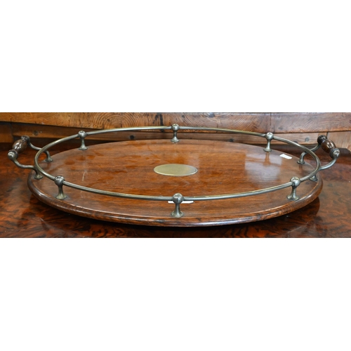 594 - An antique silver plate mounted oval oak twin handled tray, 55 x 37 cm