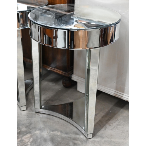 595 - A pair of Art Deco style circular mirrored occasional tables, with single frieze drawer on triform b... 