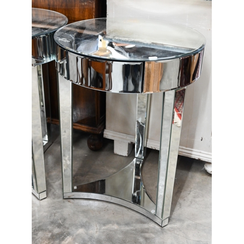 595 - A pair of Art Deco style circular mirrored occasional tables, with single frieze drawer on triform b... 