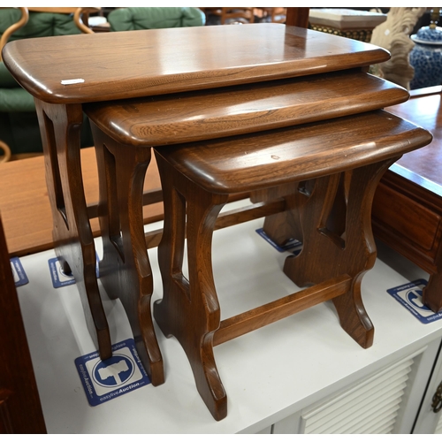 598 - A nest of three teak occasional tables by Ercol, 57 x 36 x 42 cm high