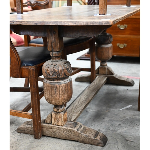 600 - An old oak refectory table raised on turned and carved bulbous ends united by a centre stretcher, 15... 