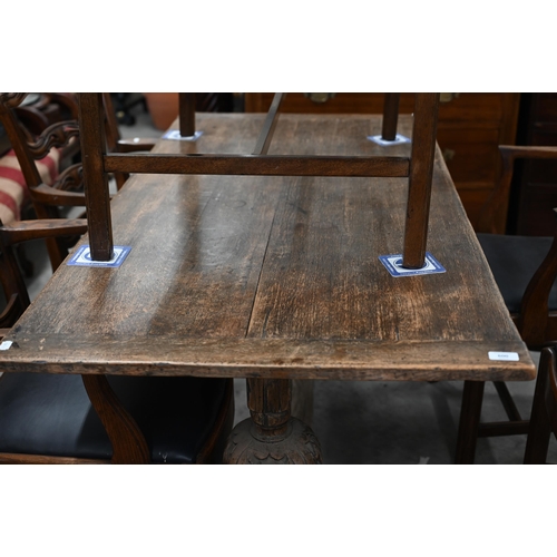 600 - An old oak refectory table raised on turned and carved bulbous ends united by a centre stretcher, 15... 