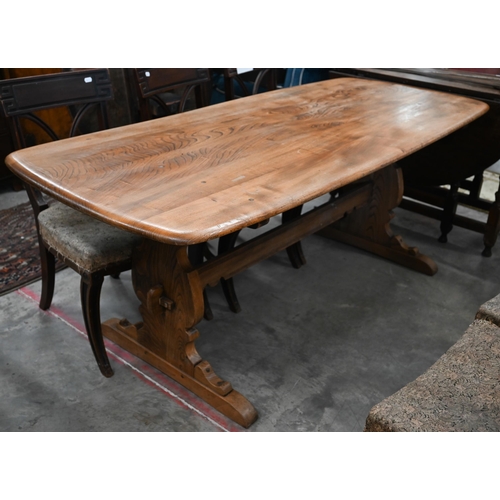 602 - A mid-century teak refectory dining table with mid-height centre stretcher, note split to top, 180 c... 