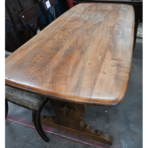 602 - A mid-century teak refectory dining table with mid-height centre stretcher, note split to top, 180 c... 