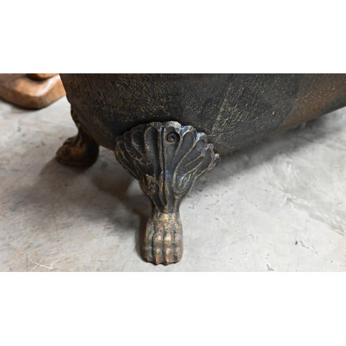 605 - An old cast iron planter trough raised on paw feet, 70 x 36 x 26 cm high