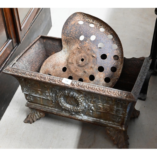 606 - A weathered Regency style cast iron planter on flared feet, to/w a vintage tractor seat (2)