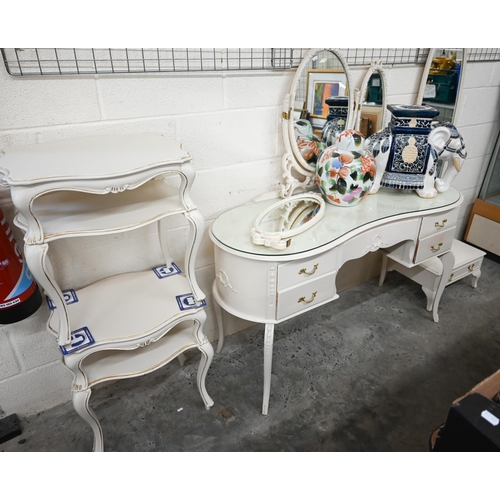 616 - A cream paint finished Italian-style mirror-backed kidney shaped dressing table by Fairyland to/w a ... 