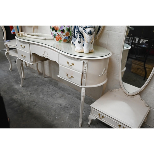 616 - A cream paint finished Italian-style mirror-backed kidney shaped dressing table by Fairyland to/w a ... 