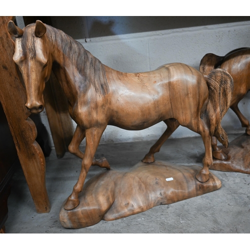 629 - A trio of carved hardwood stallion sculptures (3)