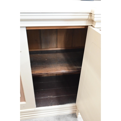 636 - # A painted over mantel mirror to/with a similarly painted sideboard with drawer and cupboards (2)... 