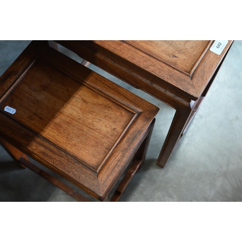 642 - A pair of graduated Chinese hardwood occasional tables (2)