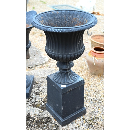 9 - A classic cast iron garden urn planter on square plinth base to/w another of flared neck design - bo... 