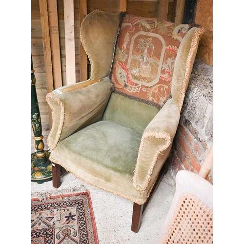 458 - # An antique mahogany framed wingback armchair on square legs (f/r)