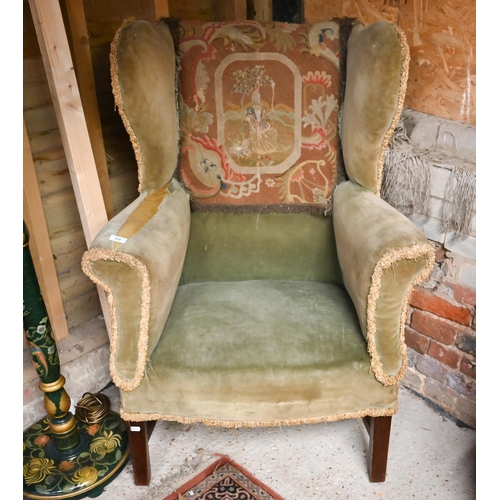 458 - # An antique mahogany framed wingback armchair on square legs (f/r)