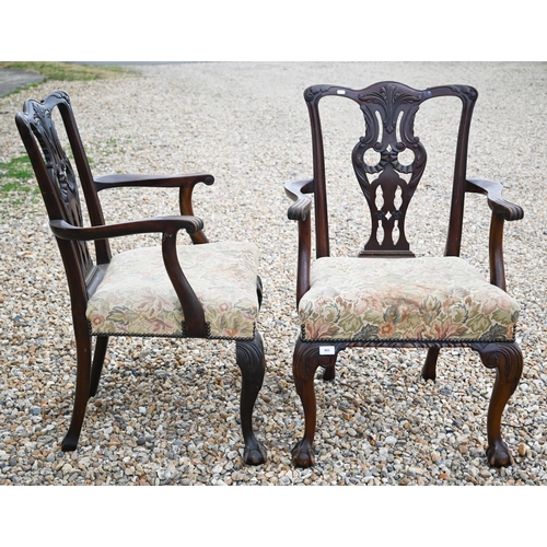 465 - # A set of six Chippendale style mahogany chairs - two dining chairs and two carvers with floral fab... 