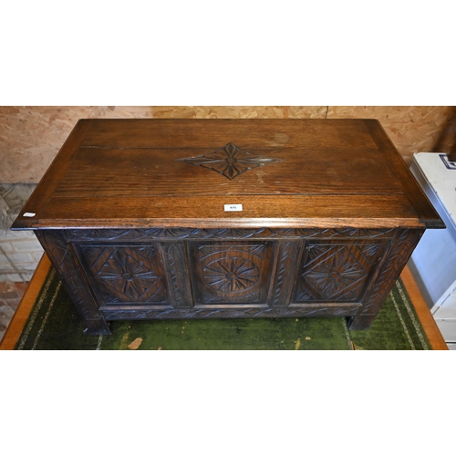 475 - A small carved panelled oak coffer with hinged top, 90 x 45 x 50 cm h