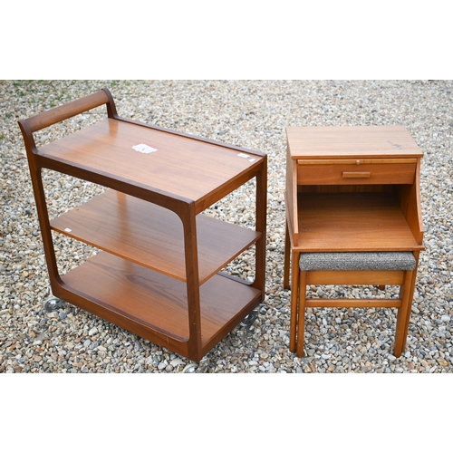 489 - A mid-century teak three-tier drinks trolley to/w a 'Chippy' teak telephone table with integrated se... 