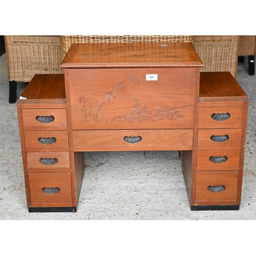 506 - A Chinese carved hardwood sewing cabinet with hinged storage compartment and drawers