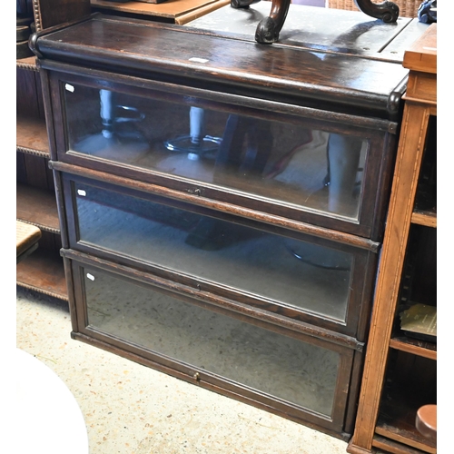 513 - An early 20th century oak three tier Globe Wernicke barrister's bookcase, 86 x 26 x 90 cm h