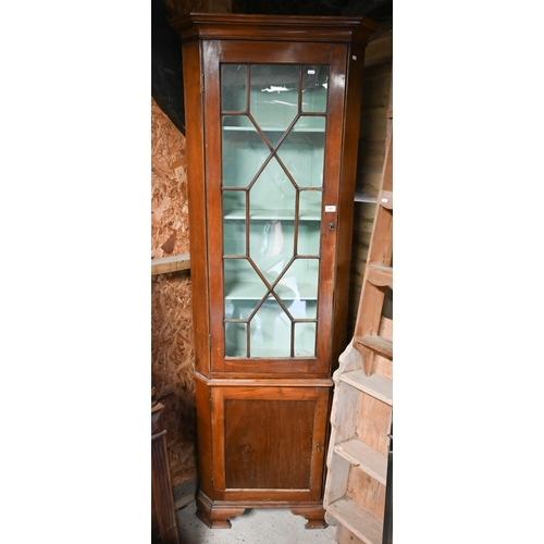 519 - An antique mahogany part glazed floor standing corner cabinet