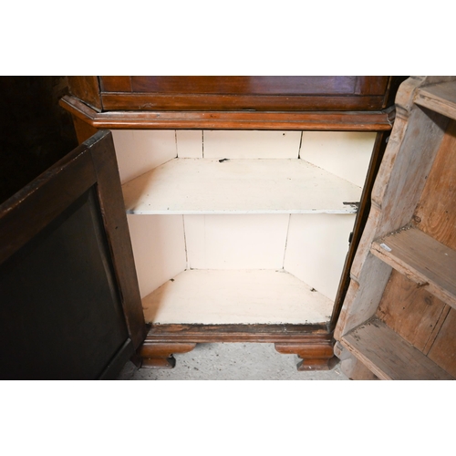 519 - An antique mahogany part glazed floor standing corner cabinet