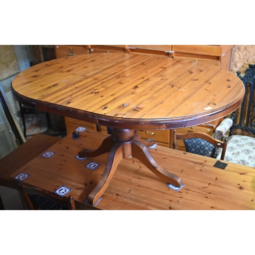 553 - # A stained pine extending dining table, 156 x 110 x 45 cm h, to/w eight chairs (6 standard and 2 ca... 