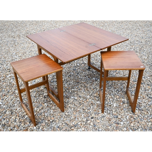 558 - A mid century teak folding tea table with two nesting tables below by McKintosh