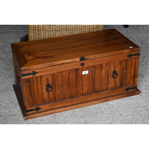 564 - A stained hardwood metal mounted trunk, 75 cm wide x 36 cm deep x 35 cm high