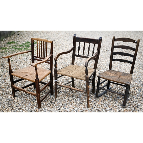 565 - # Two antique provincial rush seated carver chairs to/w single rocking chair (3)