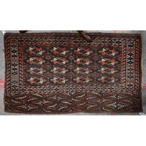 571A - A vintage Turkoman brown and red geometric gul design bag-face, 125 cm x 73 cm