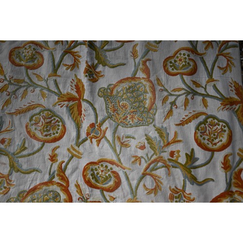 640 - A pair of crewelwork linen curtains (2)