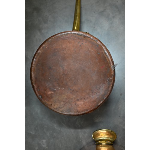 628 - A large hammered copper cylindrical vessel with brass handles to/w a hammered copper brass handled G... 