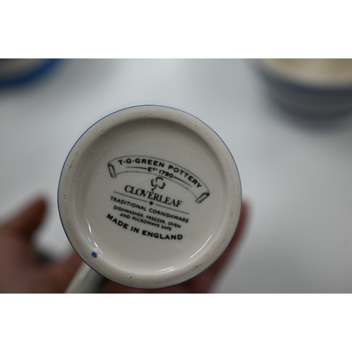 108 - A Cornish ware coffee pot, with milk and sugar pair and five mugs