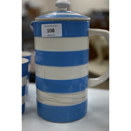 108 - A Cornish ware coffee pot, with milk and sugar pair and five mugs