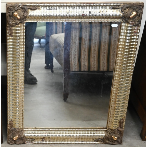 312 - A French rectangular wall mirror in decorative gilt and silvered ripple moulded frame, 58 cm wide x ... 