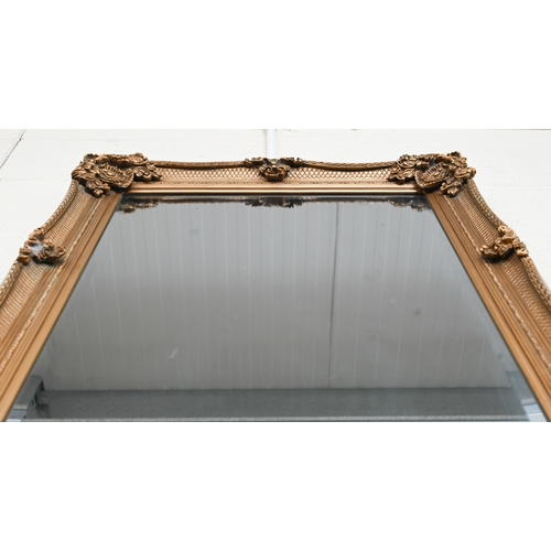 326 - A large Baroque style gilt framed wall mirror with bevelled plate