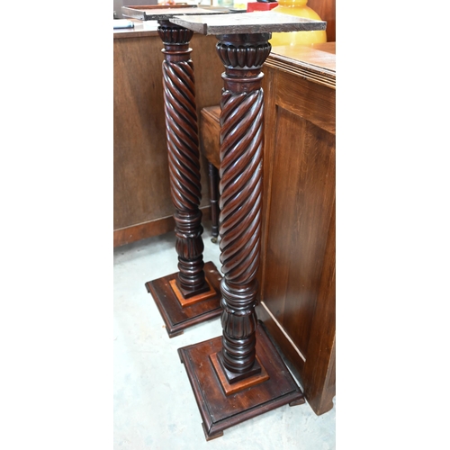 348 - A pair of stained hardwood spiral reeded torchères, 110 cm high (2)