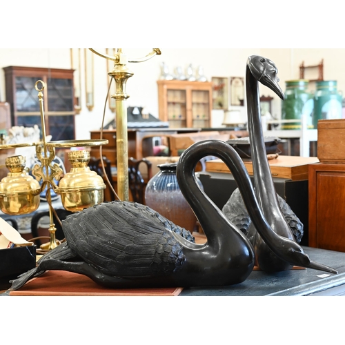 180 - Two large bronze swans, 63 cm high max. one a/f