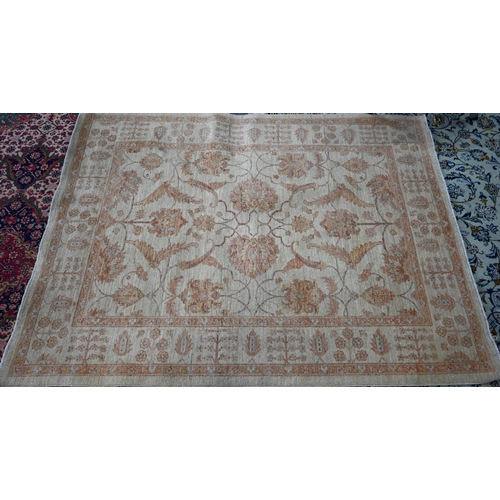 434 - A contemporary Indian Agra carpet, the yelllow/ochre ground with muted floral design, 204 cm x 154 c... 