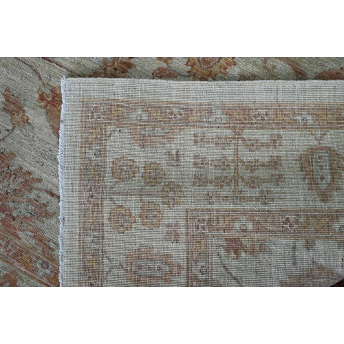 434 - A contemporary Indian Agra carpet, the yelllow/ochre ground with muted floral design, 204 cm x 154 c... 