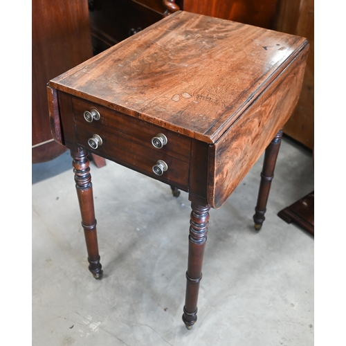 413 - A 19th century mahogany drop leaf side table with two drawers, turned supports and casters