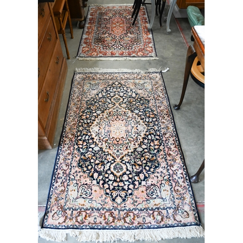 303 - Two Indo-Persian traditional floral design blue ground rugs, 150 x 94 cm and 154 x 94 cm (2)