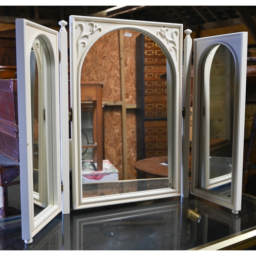 305 - An off-white and gilt folding three panel table top dressing mirror, to/w a white triptych dressing ... 