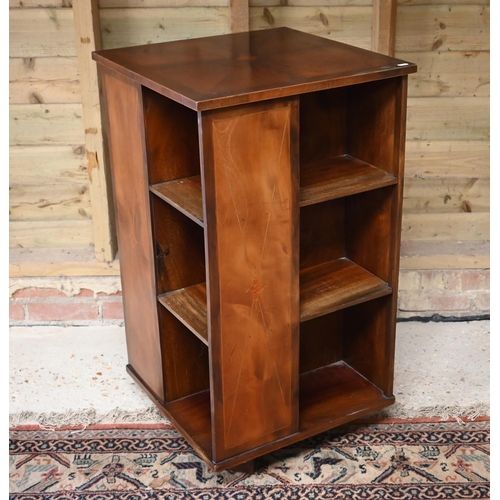 78 - # A reproduction mahogany veneered revolving bookcase, 51 cm x 51 cm x 94 cm h