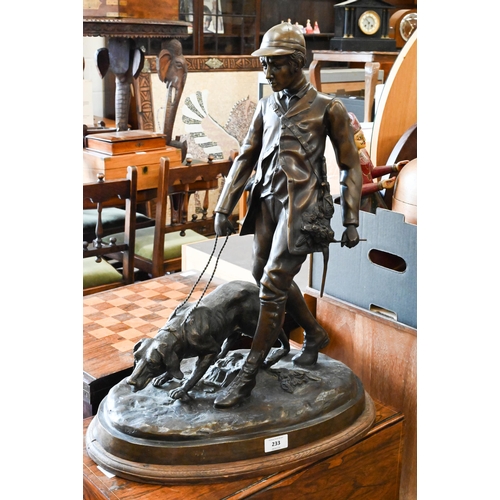 185 - A large Continental bronze group of a huntsman and dog, unsigned, 62 cm high on oval base