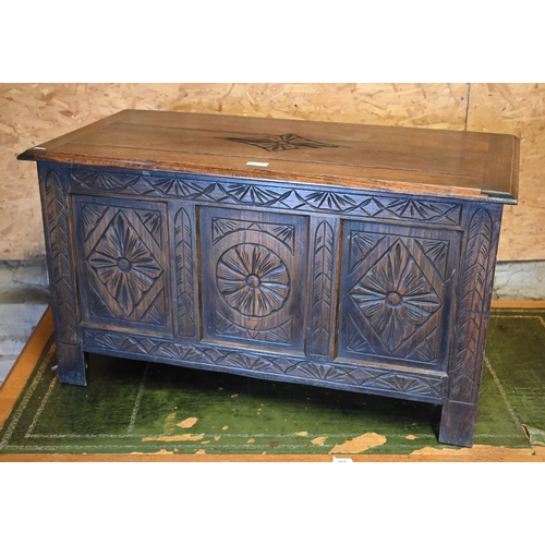 507 - A small carved panelled oak coffer with hinged top, 90 x 45 x 50 cm h